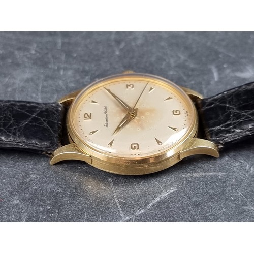 658 - A early 1960s IWC 18ct gold manual wind wristwatch, 33mm, on vintage Omega black leather strap.... 