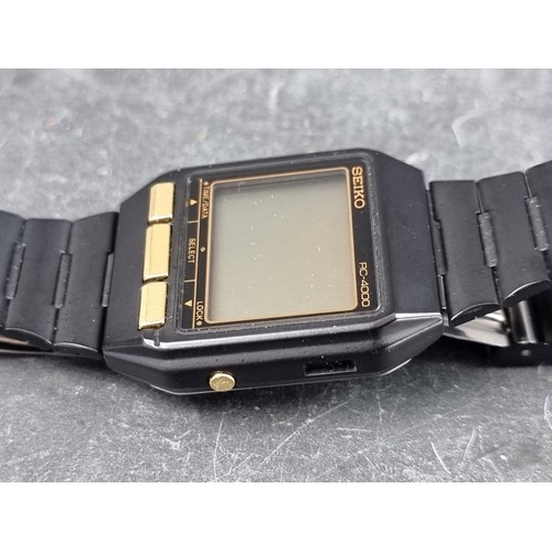 673 - A 1980s Seiko 'RC-4000 PC Datagraph' black stainless steel digital wristwatch, 34mm, Ref. S521-4000,... 