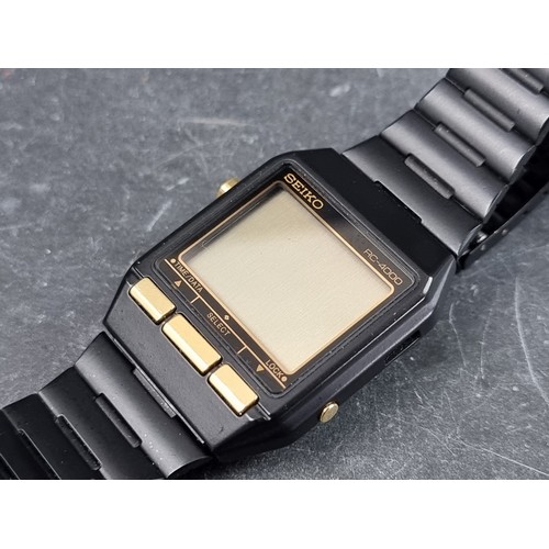 673 - A 1980s Seiko 'RC-4000 PC Datagraph' black stainless steel digital wristwatch, 34mm, Ref. S521-4000,... 