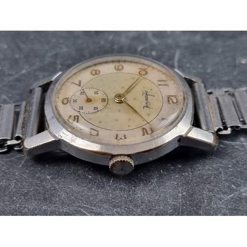 696 - A circa 1950s Accurist stainless steel manual wind wristwatch, 32mm, on stainless steel bracelet.... 