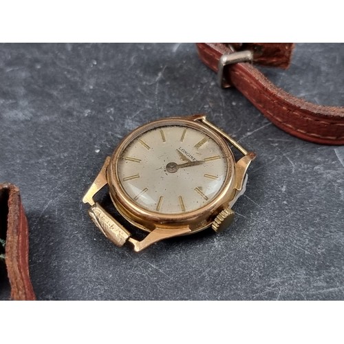 708 - A Longines 9ct gold manual wind ladies wristwatch, 21mm, with brown leather strap.