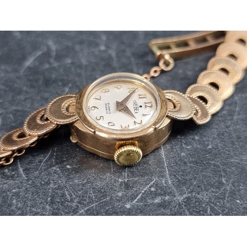 709 - A Trebex 9ct gold manual wind ladies wristwatch, 15mm, on 9ct gold bracelet.