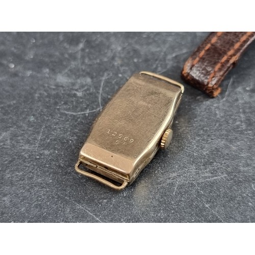 710 - A circa 1930s 9ct gold manual wind ladies wristwatch, 14mm, with brown leather strap.... 