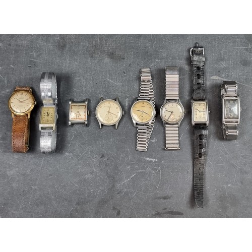 712 - A group of wristwatches, to include examples by Oris and Girard Perregaux. (8)