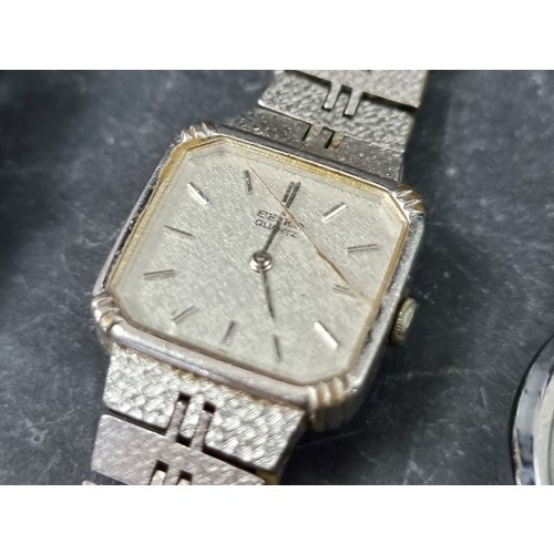 715 - A group of wristwatches, to include a Raymond Weil ladies example, Ref. 9630. (12)