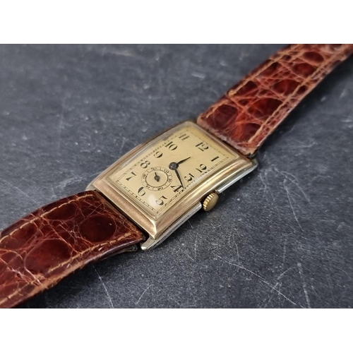 695A - A Swiss Art Deco two tone 9ct gold manual wind wristwatch, 24 X 31mm, the movement stamped 63, on re... 