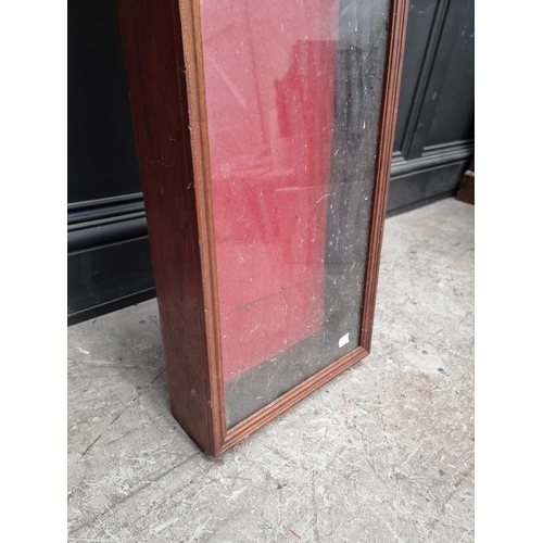 1003 - An old mahogany and stained pine display case, with sliding glass cover, 32cm high x 181cm wide x 10... 