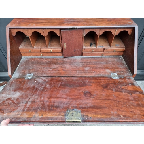 1004 - A George III mahogany bureau, 95.5cm wide. 