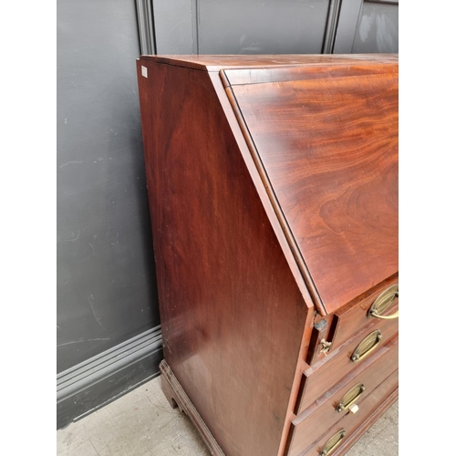 1004 - A George III mahogany bureau, 95.5cm wide. 