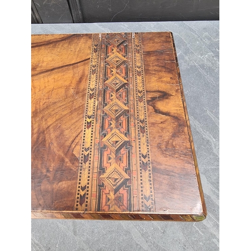 1009 - A Victorian figured walnut and parquetry writing slope, 50cm wide.