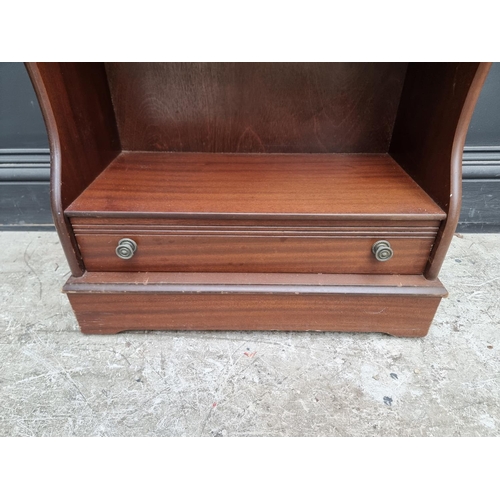 1014 - A reproduction mahogany waterfall bookcase, with apron drawer, 56.5cm wide.  ... 