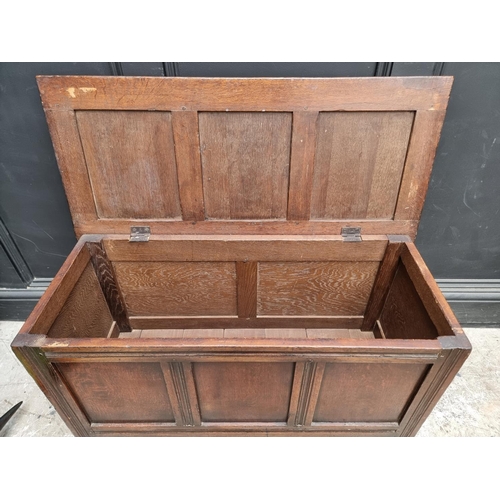 1015 - A small reproduction oak panelled coffer, 91.5cm wide.