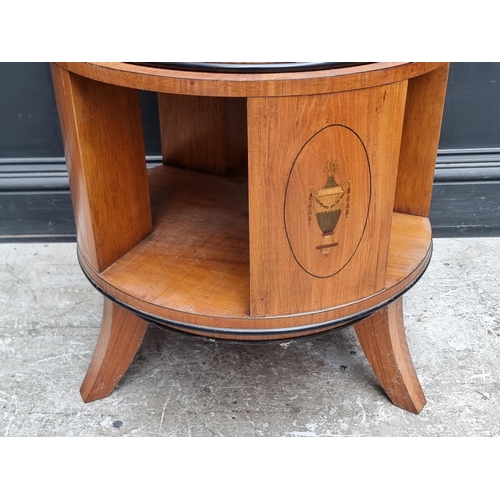 1025 - An unusual satinwood and inlaid three tier revolving bookcase, of 'wedding cake' form, each tie... 