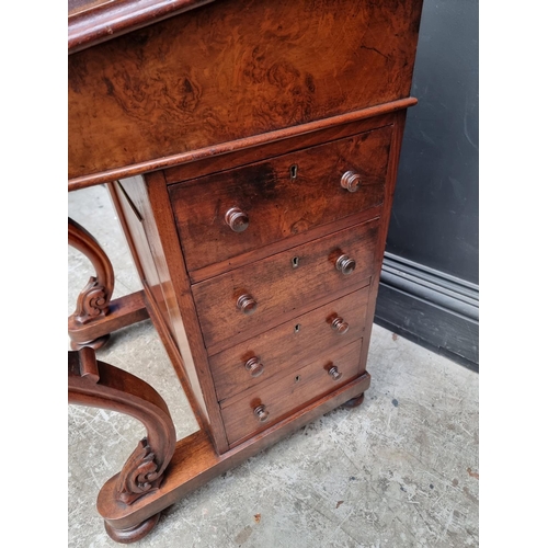 1028 - A Victorian walnut Davenport, 54.5cm wide.