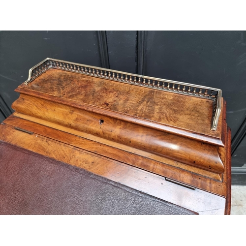 1028 - A Victorian walnut Davenport, 54.5cm wide.