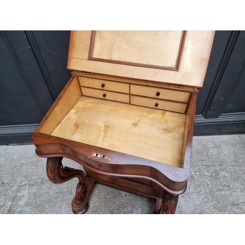 1028 - A Victorian walnut Davenport, 54.5cm wide.