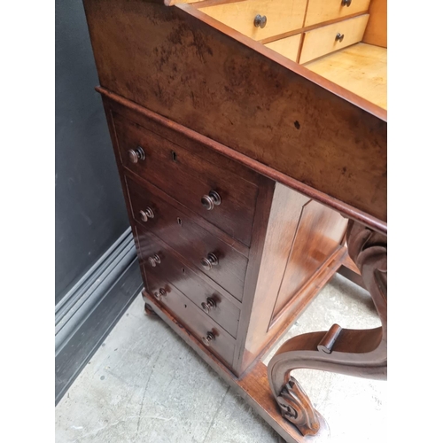 1028 - A Victorian walnut Davenport, 54.5cm wide.