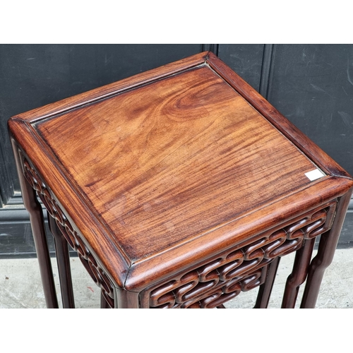 1029 - A nest of three Chinese hardwood occasional tables, largest 38cm wide, (lacking second smallest from... 