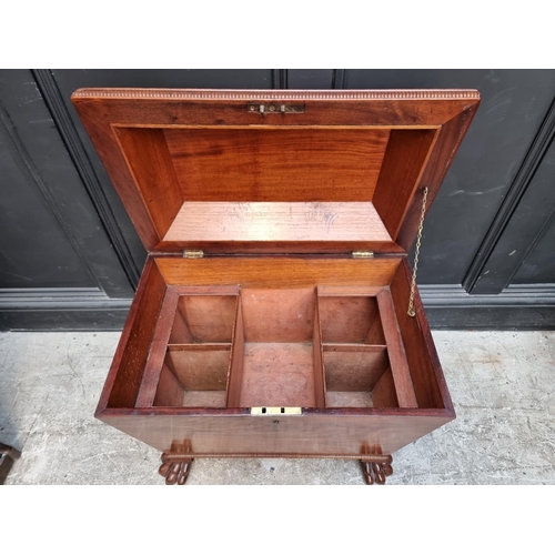 1032 - A George IV mahogany sarcophagus cellarette, on paw feet, with partially fitted interior, 69cm wide,... 