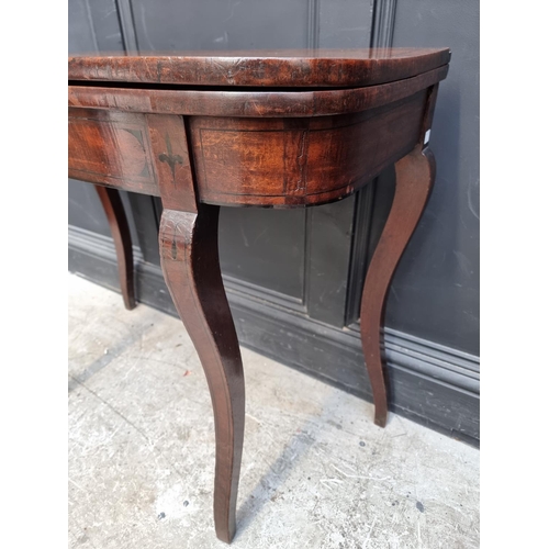 1035 - A Regency mahogany and ebony strung card table, with double gateleg action, 86.5cm wide.... 