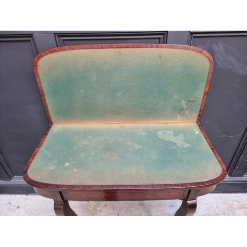 1035 - A Regency mahogany and ebony strung card table, with double gateleg action, 86.5cm wide.... 