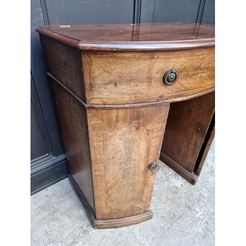 1041 - A mahogany bowfront kneehole dressing table, with hinged top, 83.5cm wide. 
