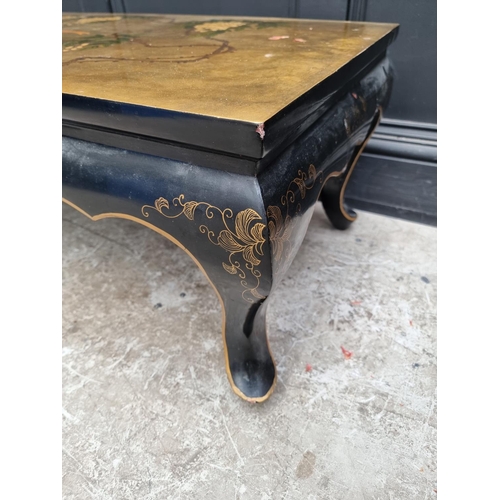 1043 - A Chinese black and gilt lacquered rectangular low occasional table, 105cm wide. ... 