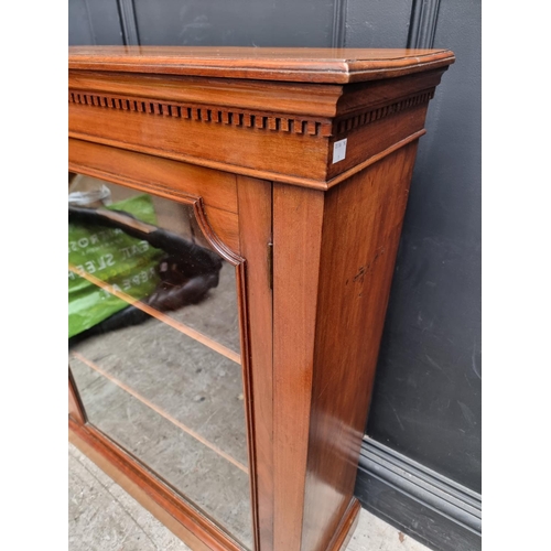 1049 - An early 20th century mahogany pier cabinet, 80.5cm wide. 