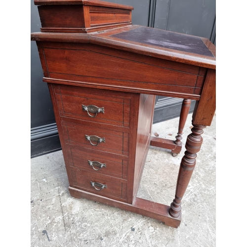 1050 - A late Victorian mahogany Davenport, 55.5cm wide. 