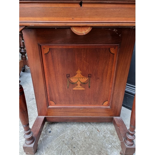 1050 - A late Victorian mahogany Davenport, 55.5cm wide. 