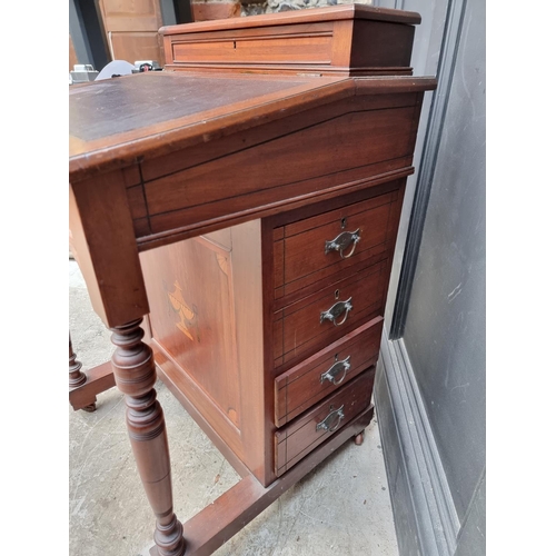 1050 - A late Victorian mahogany Davenport, 55.5cm wide. 