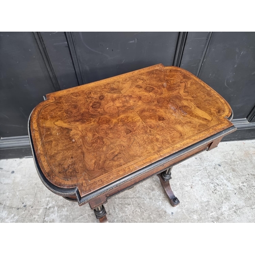 1054 - A Victorian burr walnut, ebonized and inlaid work table, indistinctly stamped 'Lamb, Manchester', 62... 