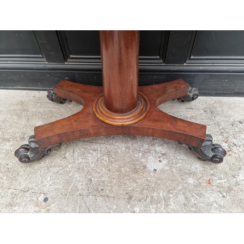 1057 - A Victorian mahogany pedestal card table, 91cm wide. 