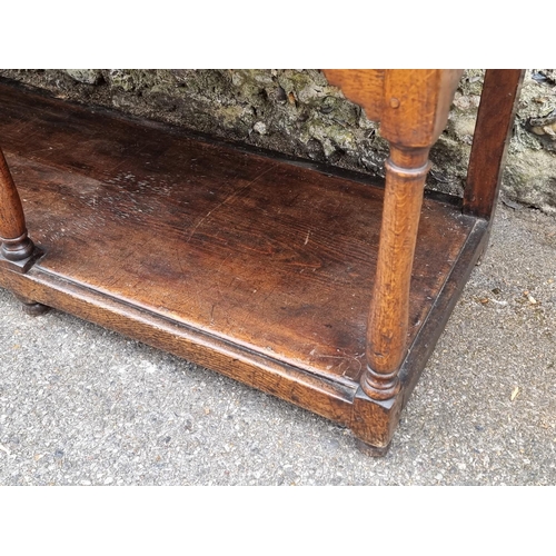 1058 - A George III oak pot board dresser base, 180cm wide. 