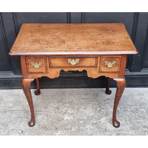 1060 - A George II mahogany and walnut crossbanded lowboy, 88cm wide.