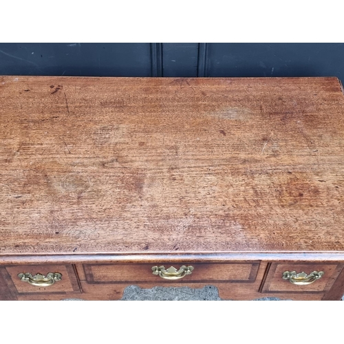 1060 - A George II mahogany and walnut crossbanded lowboy, 88cm wide.