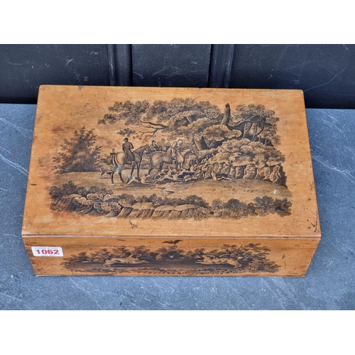 1062 - A Regency penwork casket, decorated with sporting scenes, 30.5cm wide. 