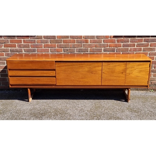 1100 - A mid-century teak sideboard, by White & Newton, labelled, 216.5cm wide.