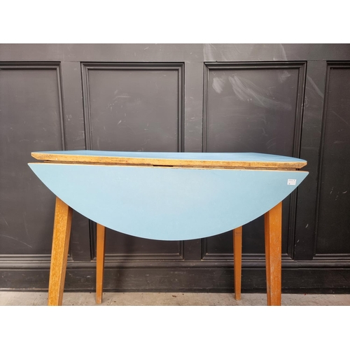 1102 - A mid-century drop leaf kitchen table, 90cm wide.