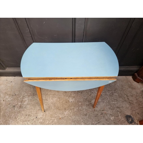 1102 - A mid-century drop leaf kitchen table, 90cm wide.