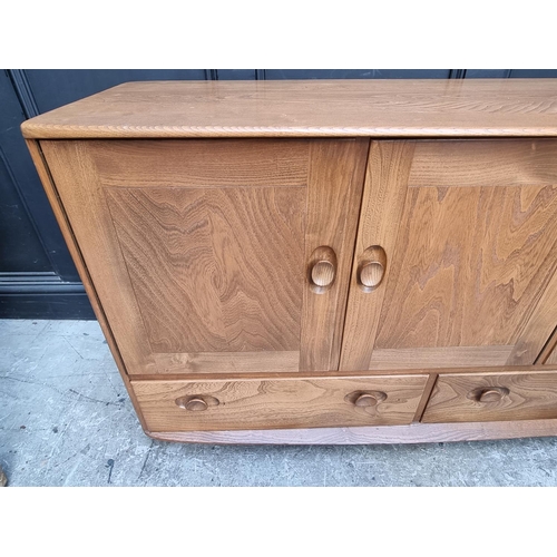 1105 - A mid-century Ercol sideboard, 129.5 wide.