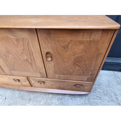 1105 - A mid-century Ercol sideboard, 129.5 wide.