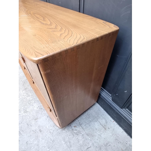 1105 - A mid-century Ercol sideboard, 129.5 wide.