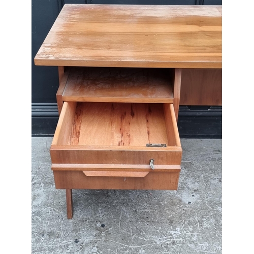 1107 - A mid-century continental walnut desk, 110cm wide.