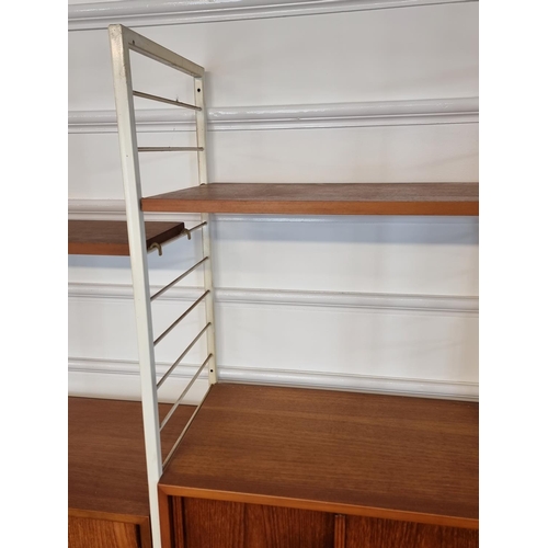 1111 - A mid-century Ladderax modular five bay shelving unit, white.