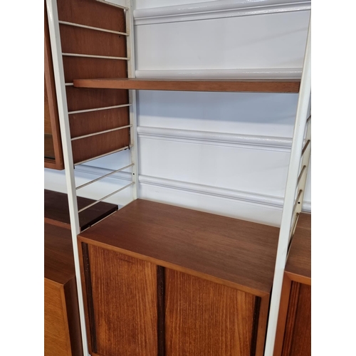 1111 - A mid-century Ladderax modular five bay shelving unit, white.