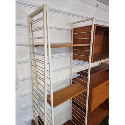 1111 - A mid-century Ladderax modular five bay shelving unit, white.