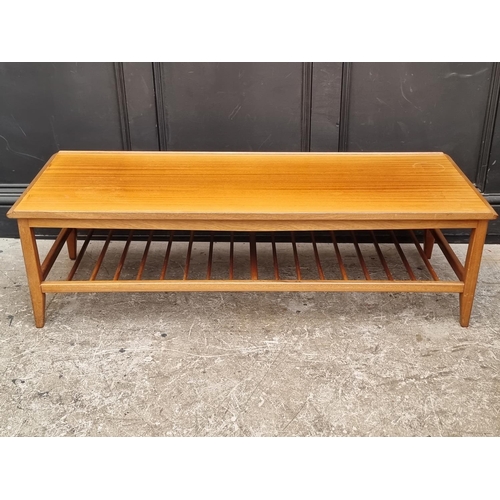 1114 - A mid-century G-plan teak rectangular low occasional table, with spindle undertier, 124.5cm wide.... 