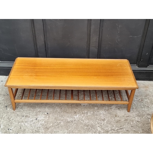 1114 - A mid-century G-plan teak rectangular low occasional table, with spindle undertier, 124.5cm wide.... 