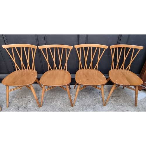 1115 - A set of four mid-century Ercol 'Candlestick' dining chairs.